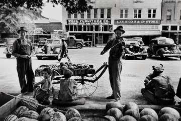 Melon Salesman And Fidler At a Marketplace in Scott, Mississippi Photography - Alfred Eisenstaedt Melon Salesman And Fidler At a Marketplace in Scott, Mississippi Photography - Alfred Eisenstaedt