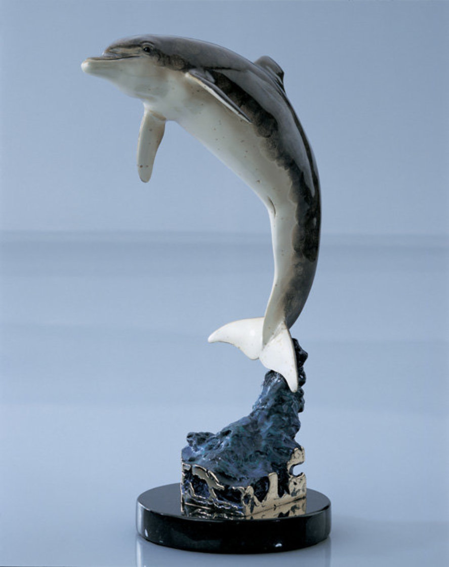 Robert Wyland dolphin statue, water by Robert Wyland